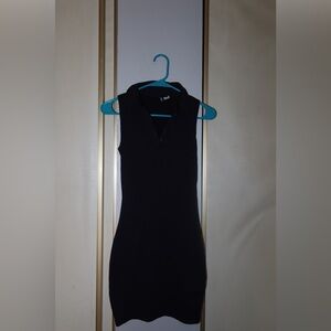 Ribbed mini black dress. Polo neckline. Size Xs.